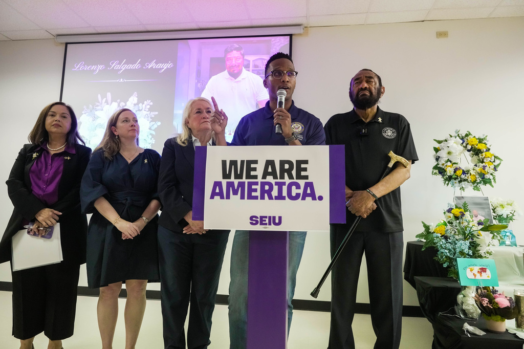 U.S. Rep. Christian Menefee speaks during a community vigil for Lorenzo Salgado Araujo as U.S. Rep. Sylvia Garcia, left, and U.S. Rep. Al Green look on in Houston on Saturday, July 11, 2026. (Raquel Natalicchio/Houston Chronicle via AP)