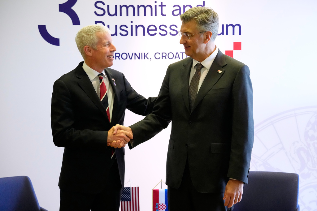 Secretary of energy Chris Wright, left, is welcomed by Croatian Prime Minister Andrej Plenkovic at the Three Seas Initiative summit in Dubrovnik, Croatia, Tuesday, April 28, 2026. (AP Photo/Darko Bandic)