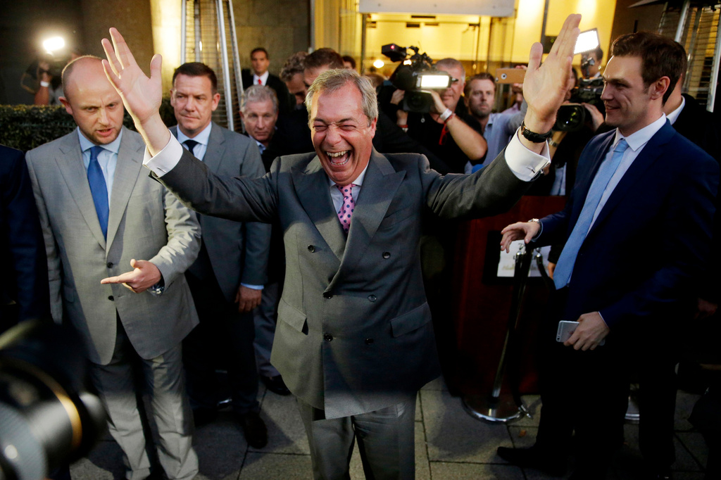 FILE - Nigel Farage, the leader of the UK Independence Party, celebrates and poses for photographers as he leaves a "Leave.EU" organization party for the British European Union membership referendum in London., June 24, 2016. (AP Photo/Matt Dunham, File)