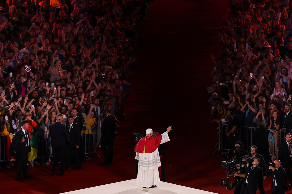 Pope Leo XIV waves after a prayer vigil with young people at the Stade de France in Saint-Denis near Paris, Friday, Sept. 25, 2026. (AP Photo/Thomas Padilla)