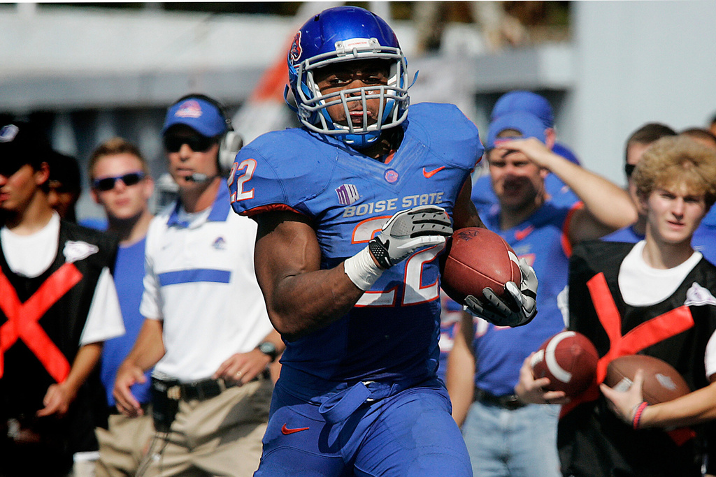 FILE - Boise State's Doug Martin (22) runs for a touchdown during the second half of an NCAA college football game against Nevada, Saturday, Oct. 1, 2011 in Boise, Idaho. (AP Photo/Matt Cilley, File)