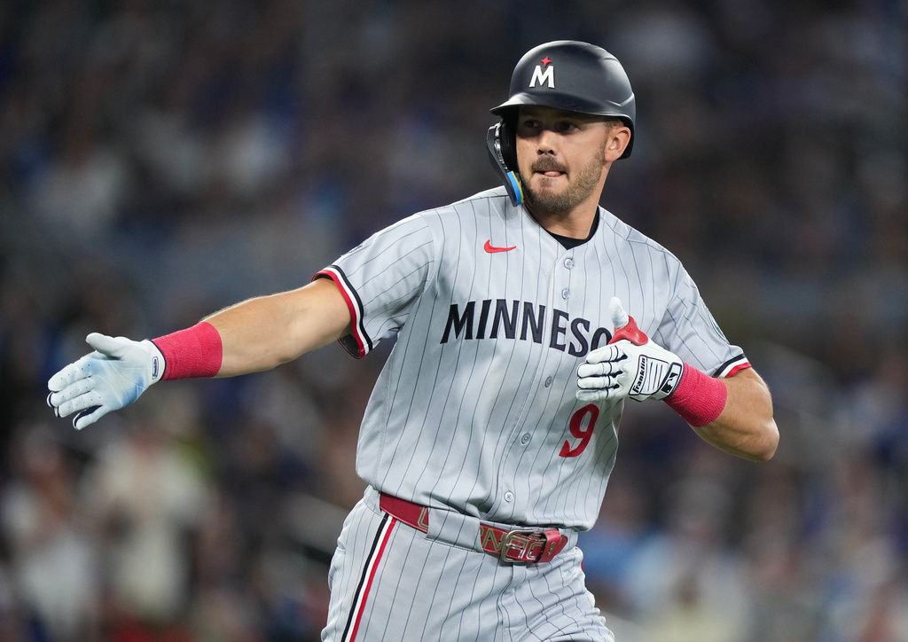 Minnesota Twins' Trevor Larnach celebrates his three-run home run during the third inning of a baseball action against the Toronto Blue Jays in Toronto, Saturday, April 11, 2026. (Nathan Denette/The Canadian Press via AP)