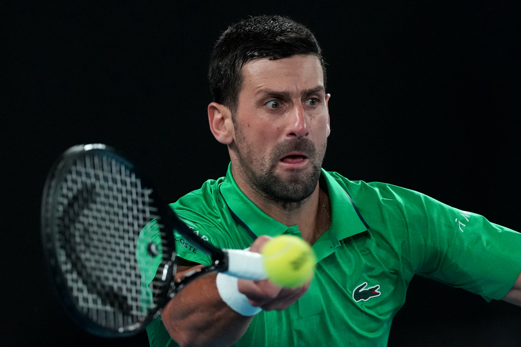 Novak Djokovic of Serbia plays a forehand return to Carlos Alcaraz of Spain during the men's singles final at the Australian Open tennis championship in Melbourne, Australia, Feb. 1, 2026. (AP Photo/Aaron Favila, file)