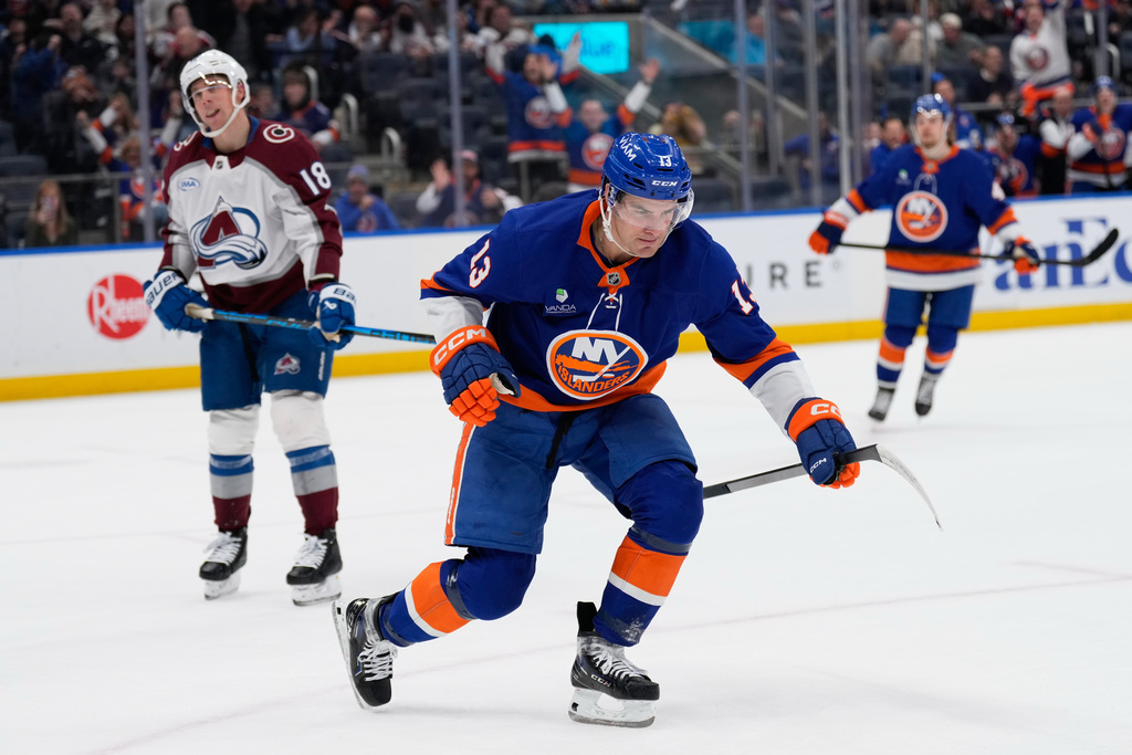 New York Islanders' Mathew Barzal celebrates his goal during the second period of an NHL hockey game against the Colorado Avalanche, Thursday, Dec. 4, 2025, in Elmont, N.Y. (AP Photo/Seth Wenig)