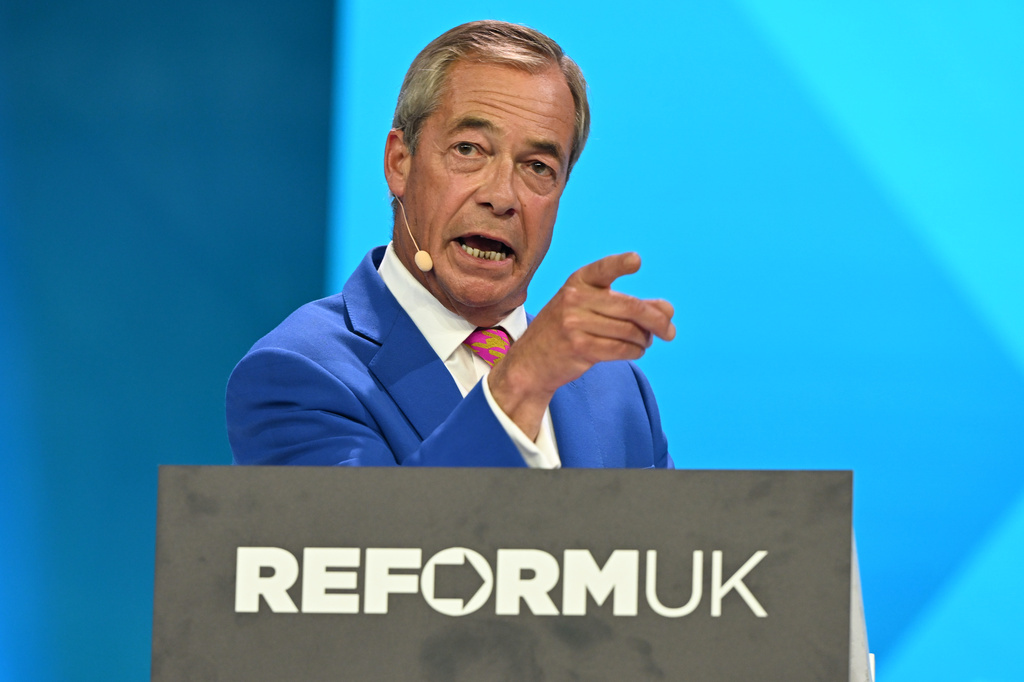 Reform Party Leader Nigel Farage points as he speaks during the Reform party's annual conference at the National Exhibition Centre in Birmingham, England, Friday, Sept. 4, 2026. (AP Photo/Thomas Krych)