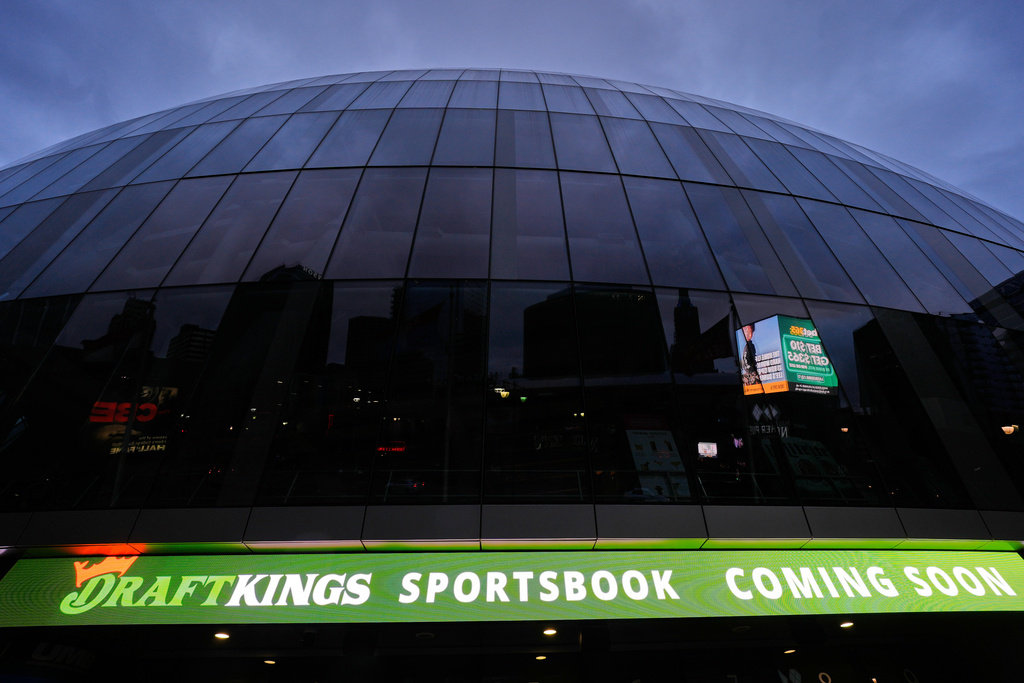 An advertisement for a sports betting app is seen on the side of the T-Mobile arena, Saturday, Nov. 29, 2025, in Kansas City, Mo. (AP Photo/Charlie Riedel)
