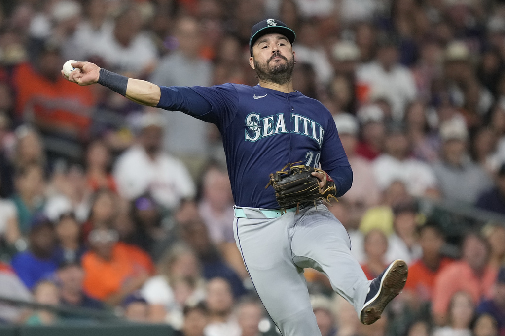 Seattle Mariners third baseman Eugenio Suárez (28) throws out Houston Astros' Jake Meyers on a ground ball during the third inning of a baseball game Friday, Sept. 19, 2025, in Houston. (AP Photo/Kevin M. Cox)