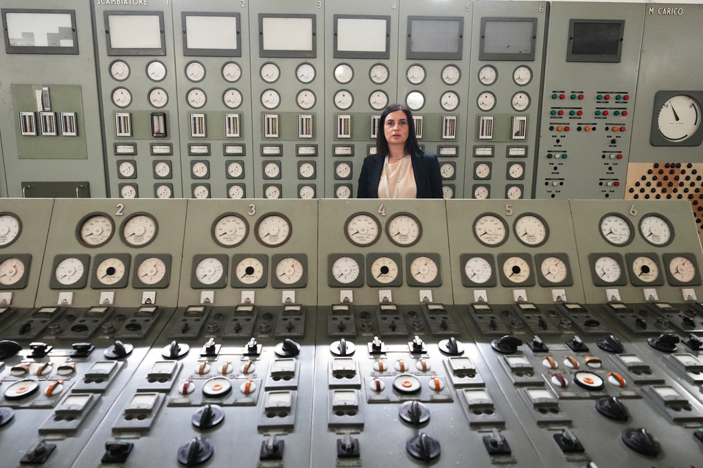 Viviana Cruciani, who oversees nuclear decommissioning of the former nuclear power plant of Latina, Italy, poses for a photo in the old control room during an interview with The Associated Press in Latina, Thursday, June 18, 2026. (AP Photo/Alessandra Tarantino)