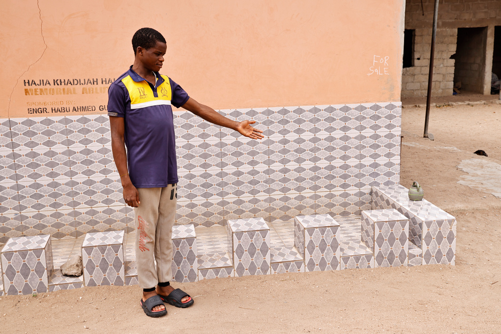 A student from an orphanage school that was abducted with others by gunmen in late April, is photographed following his released in Lokoja, Nigeria, Thursday, May 7, 2026. (AP Photo/Haruna Yahaya)