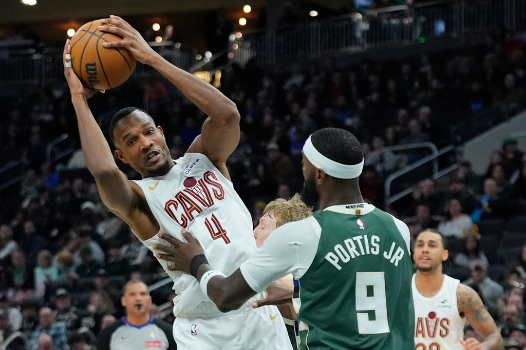 Cleveland Cavaliers' Evan Mobley (4) drives to the basket against Milwaukee Bucks' Bobby Portis during the first half of an NBA basketball game, Tuesday, March 17, 2026, in Milwaukee. (AP Photo/Aaron Gash)
