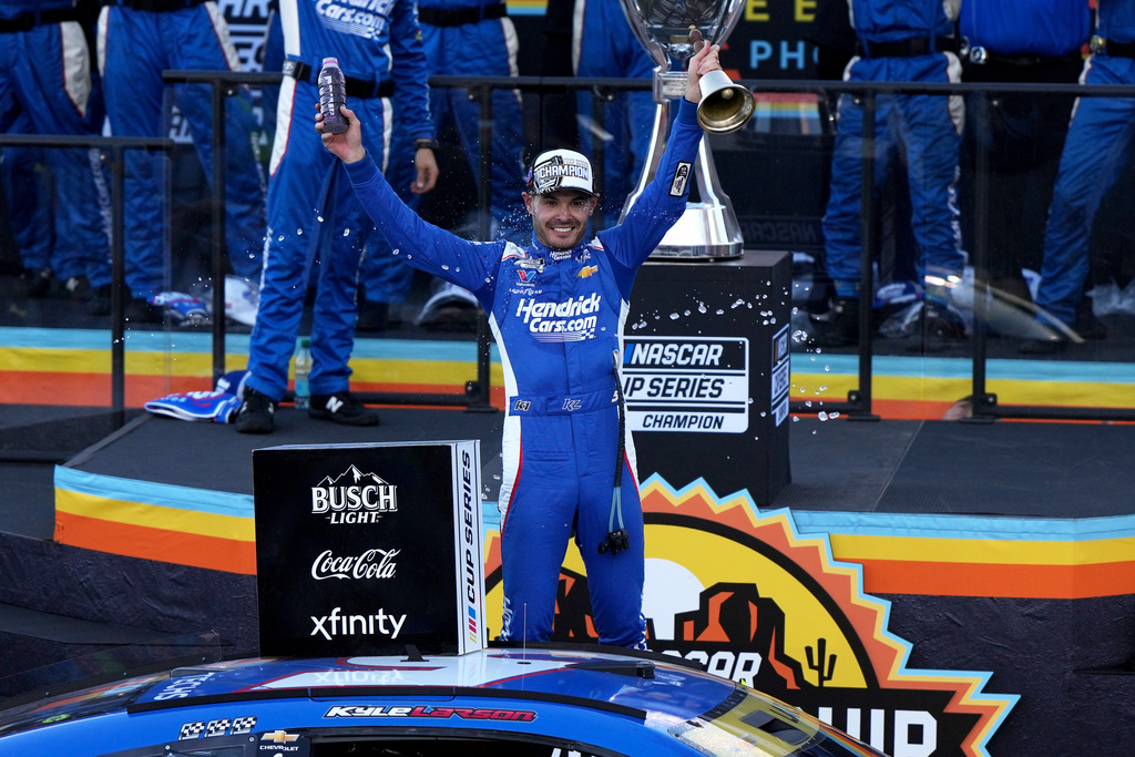 Kyle Larson celebrates after winning the NASCAR Cup Series championship Sunday, Nov. 2, 2025, in Avondale, Ariz. (AP Photo/Rick Scuteri)