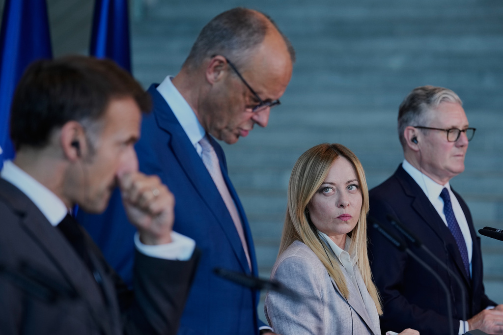 French President Emmanuel Macron, German Chancellor Friedrich Merz, Italian Prime Minister Giorgia Meloni and Britain's Prime Minister Keir Starmer attend a press conference at the E5 NATO Summit in Berlin, Germany, Wednesday, June 24, 2026. (AP Photo/Ebrahim Noroozi)