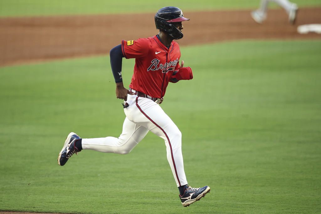 Atlanta Braves' Jurickson Profar runs to score in the first inning of a baseball game against the Seattle Mariners, Friday, Sept. 5, 2025, in Atlanta. (AP Photo/Colin Hubbard)