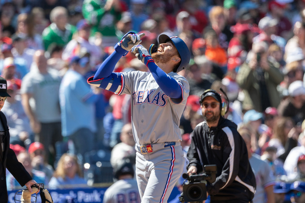 Texas Rangers' Brandon Nimmo celebrates his two run homer in the third inning of a baseball game against the Philadelphia Phillies, Sunday, March 29, 2026, in Philadelphia. (AP Photo/Laurence Kesterson)