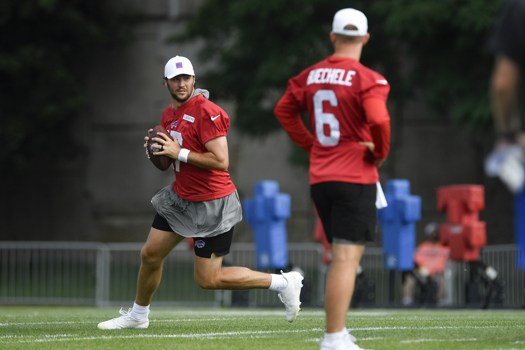Buffalo Bills quarterback Josh Allen (17) warms up during practice at the team's NFL football training camp, Sunday, July 27, 2025, in Pittsford, N.Y. (AP Photo/Adrian Kraus)