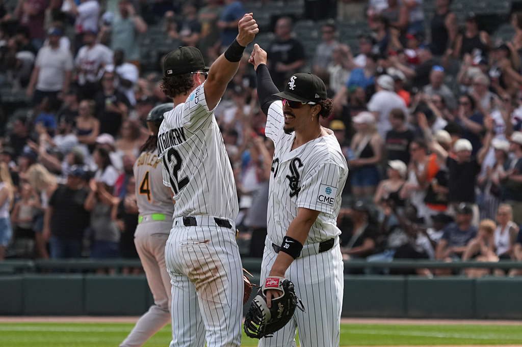 Chicago White Sox shortstop Colson Montgomery, left, and first baseman Miguel Vargas, right, celebrate their win against the Athletics in a baseball game Saturday, July 11, 2026, in Chicago. (AP Photo/David Banks)