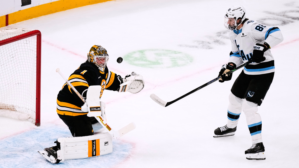 Boston Bruins goaltender Jeremy Swayman (1) makes the save on a shot by Utah Mammoth center Kevin Stenlund (82) during the first period of an NHL hockey game, Tuesday, Dec. 16, 2025, in Boston. (AP Photo/Charles Krupa)