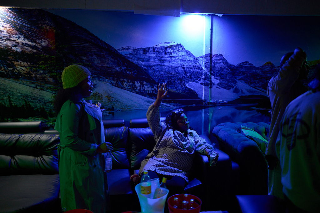 FILE - A woman dances to music inside a club in Maseru, Lesotho, July 20, 2025. (AP Photo/Bram Janssen, File)