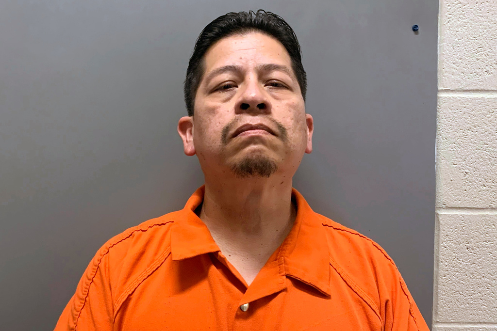 FILE - This booking image provided by Uvalde County, Texas, Sheriff's Office shows Adrian Gonzales, a former police officer for schools in Uvalde, Texas. (Uvalde County Sheriff's Office via AP, File)
