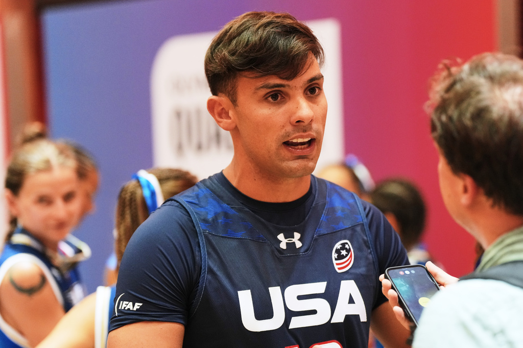 United States quarterback Nicholas Casares speaks to the Associated Press during the media day ahead of the Flag Football World Championships, the sports first Olympic qualifier for LA28, in Duesseldorf, Germany, Wednesday, Aug. 12, 2026. (AP Photo/Martin Meissner)