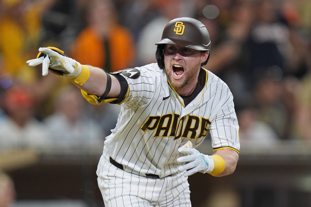 San Diego Padres' Jake Cronenworth celebrates after hitting a walk off single during the ninth inning as the Padres defeated the San Francisco Giants 6-5 in a baseball game Saturday, Aug. 1, 2026, in San Diego. (AP Photo/Gregory Bull)