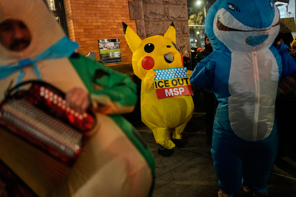 People participate in a protest and noise demonstration calling for an end to federal immigration enforcement operations in the city, Friday, Jan. 9, 2026, in Minneapolis. (AP Photo/John Locher)