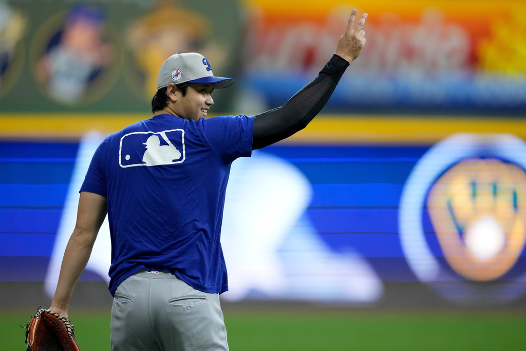 Los Angeles Dodgers' Shohei Ohtani warms up during batting practice ahead of Game 1 of baseball's National League Championship Series between the Milwaukee Brewers and the Los Angeles Dodgers on Sunday, Oct. 12, 2025, in Milwaukee. (AP Photo/Ashley Landis)