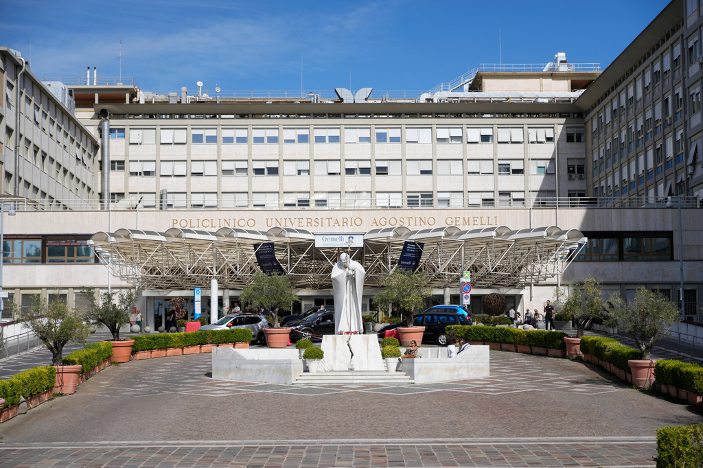 The statue of late pope St. John Paul II, center, is pictured at the Agostino Gemelli Polyclinic in Rome, Sunday, Oct. 11, 2026. (AP Photo/Gregorio Borgia)