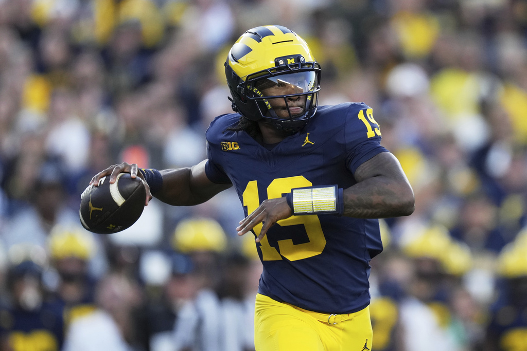 Michigan quarterback Bryce Underwood looks to throw during the first half of an NCAA college football game against New Mexico, Saturday, Aug. 30, 2025, in Ann Arbor, Mich. (AP Photo/Ryan Sun)