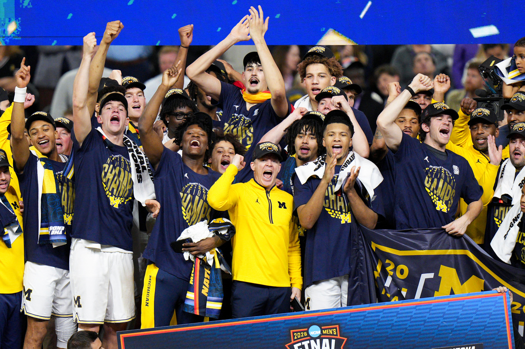 Michigan celebrates after defeating UConn in the NCAA college basketball tournament national championship game at the Final Four, Monday, April 6, 2026, in Indianapolis. (AP Photo/AJ Mast)