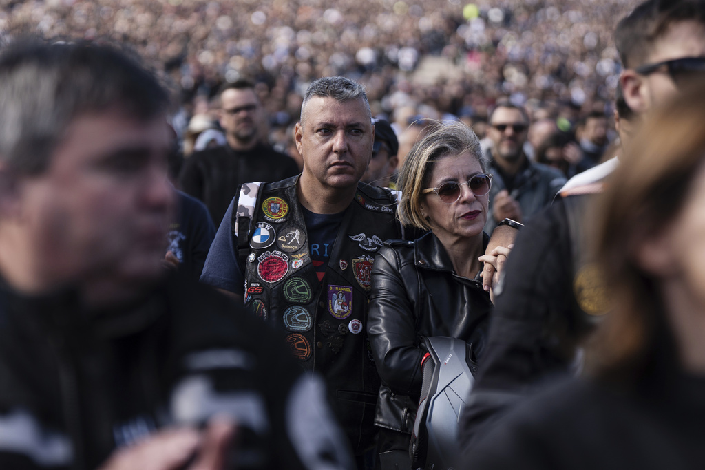 Motorcyclists attend mass at the Roman Catholic holy shrine of Fatima, during the 10th Pilgrimage of the Blessing of Helmets that draws tens of thousands, in Fatima, Portugal, Sunday, Sept. 21, 2025. (AP Photo/Ana Brigida)