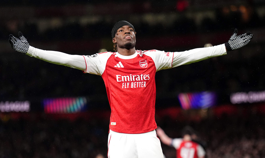 Arsenal's Noni Madueke celebrates after scoring his side's second goal during the Champions League opening phase soccer match between Arsenal and Bayern Munich in London, Wednesday, Nov. 26, 2025. (John Walton/PA via AP)