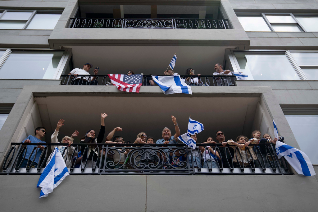 Spectators cheer on parade participants during the Israel Day Parade, Sunday, May 31, 2026, in New York. (AP Photo/Emil T. Lippe)