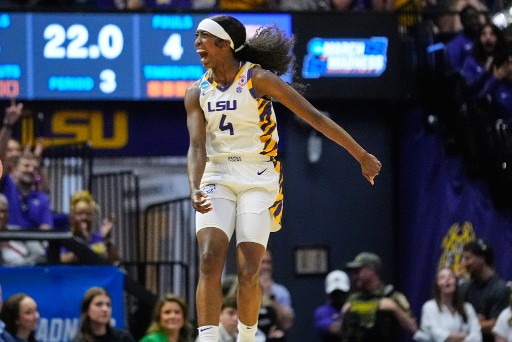 LSU guard Flau'jae Johnson (4) celebrates against Texas Tech during the second half in the second round of the NCAA college basketball tournament, Sunday, March 22, 2026, in Baton Rouge, La. (AP Photo/Gerald Herbert)