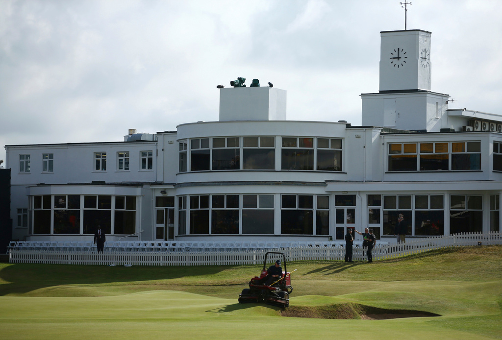 FILE - A groundsman prepares the 18th green ahead of the final round of the British Open Golf Championship, at Royal Birkdale, Southport, England, Sunday July 23, 2017. (AP Photo/Dave Thompson, File)