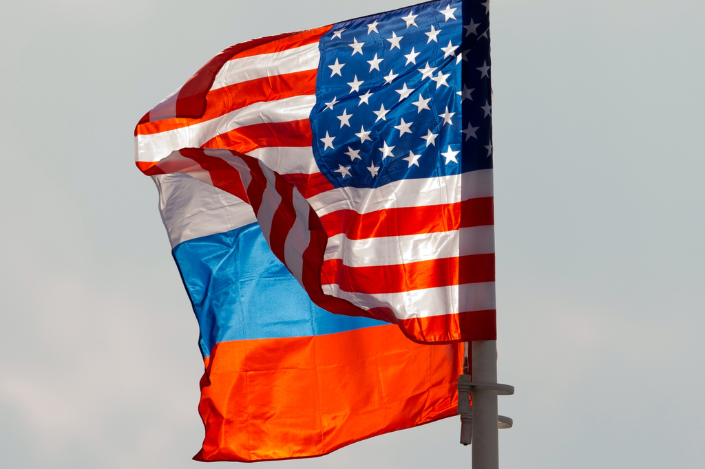 FILE - U.S. and Russian national flags wave on the wind at Moscow's Vnukovo airport, Russia, April 11, 2017. (AP Photo/ Ivan Sekretarev, File)