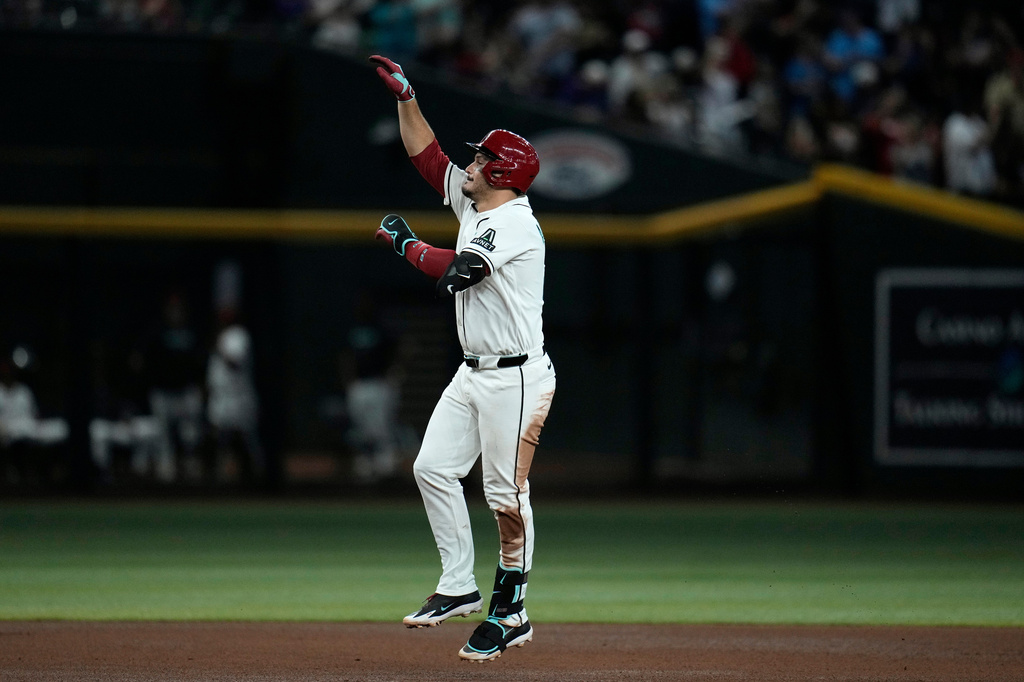 Arizona Diamondbacks' Nolan Arenado celebrates his home run against the Athletics during the fourth inning of a baseball game, Wednesday, July 22, 2026, in Phoenix. (AP Photo/Ross D. Franklin)