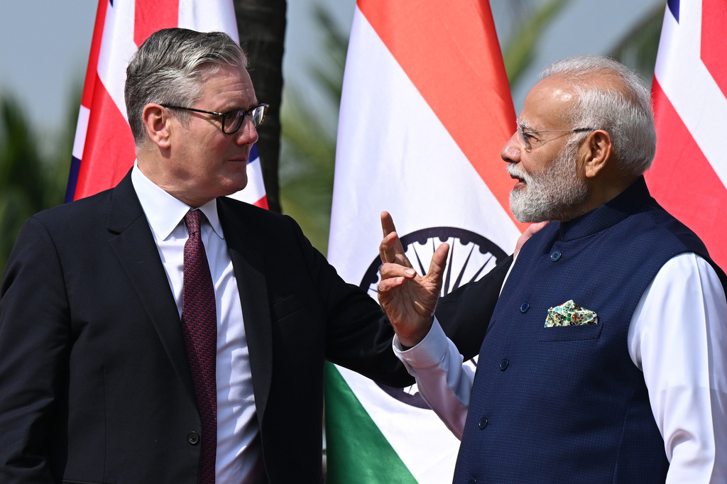 British Prime Minister Keir Starmer, left is greeted by Indian Prime Minister Narendra Modi on his arrival at Raj Bhavan in Mumbai, India, Thursday, Oct. 9, 2025. (Leon Neal/Pool Photo via AP)