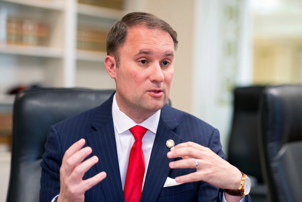 FILE - Virginia Attorney General Jason Miyares speaks during an interview at the Office of the Attorney General in Richmond, Va., May 9, 2023. (AP Photo/Ryan M. Kelly, File)