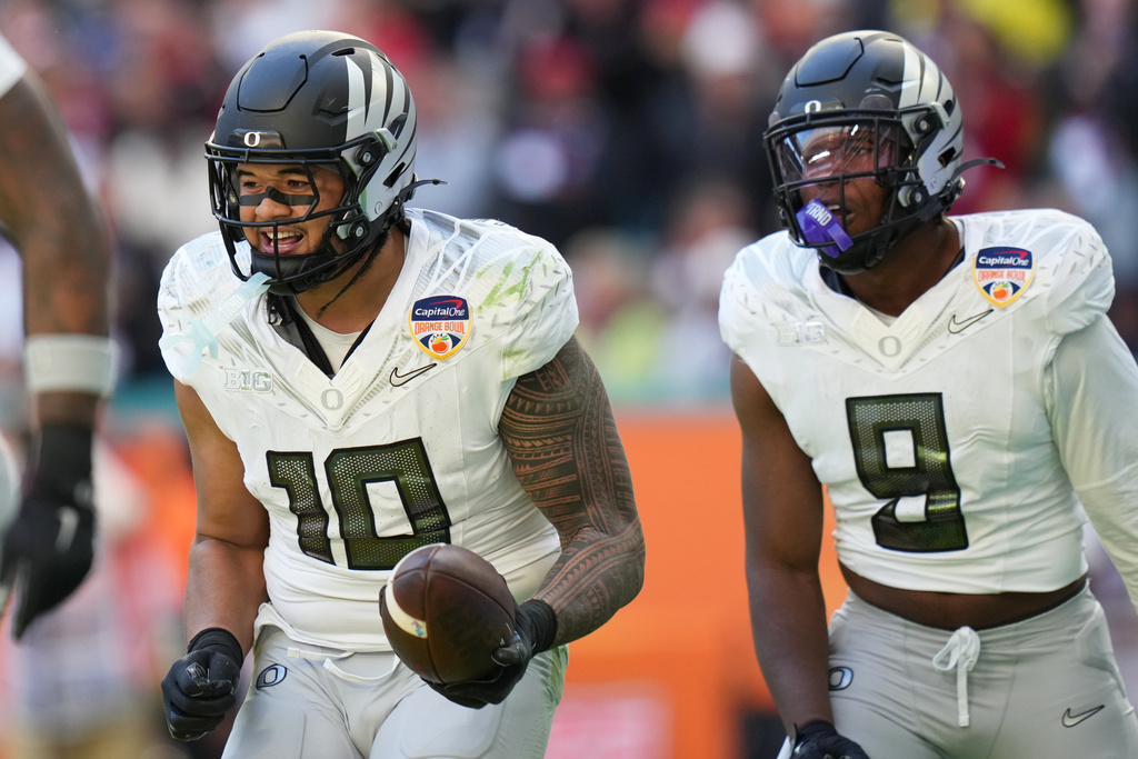 Oregon linebacker Matayo Uiagalelei (10) reacts after intercepting the football during the second half of the Orange Bowl College Football Playoff quarterfinal game against Texas Tech, Thursday, Jan. 1, 2026, in Miami Gardens, Fla. (AP Photo/Lynne Sladky)