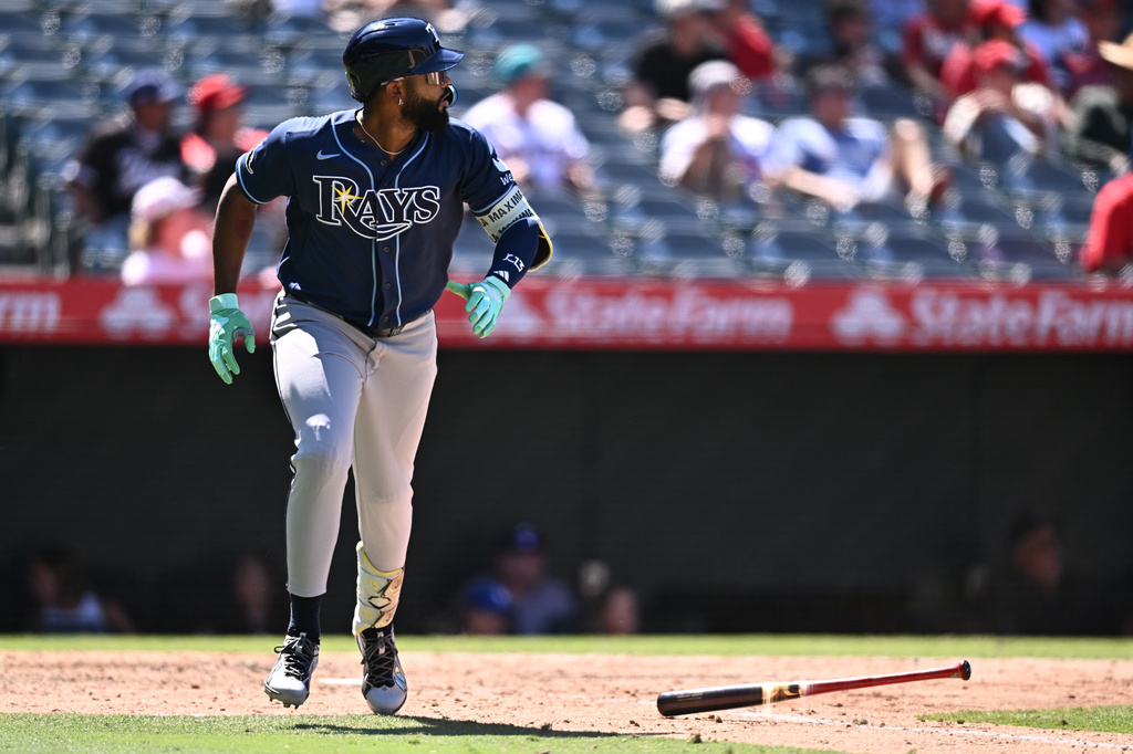 Tampa Bay Rays' Junior Caminero watches his home run during the eighth inning of a baseball game against the Los Angeles Angels, Sunday, June 14, 2026, in Anaheim, Calif. (AP Photo/William Liang)