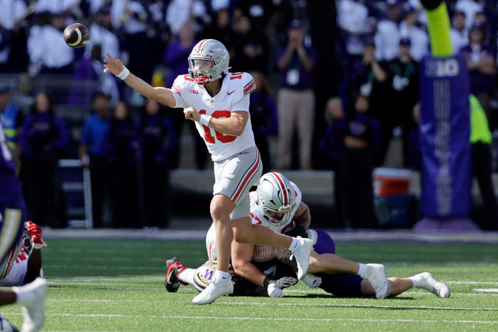 Ohio State quarterback Julian Sayin (10) passes against the Washington during the first half of an NCAA college football game, Saturday, Sept. 27, 2025, in Seattle. (AP Photo/John Froschauer)