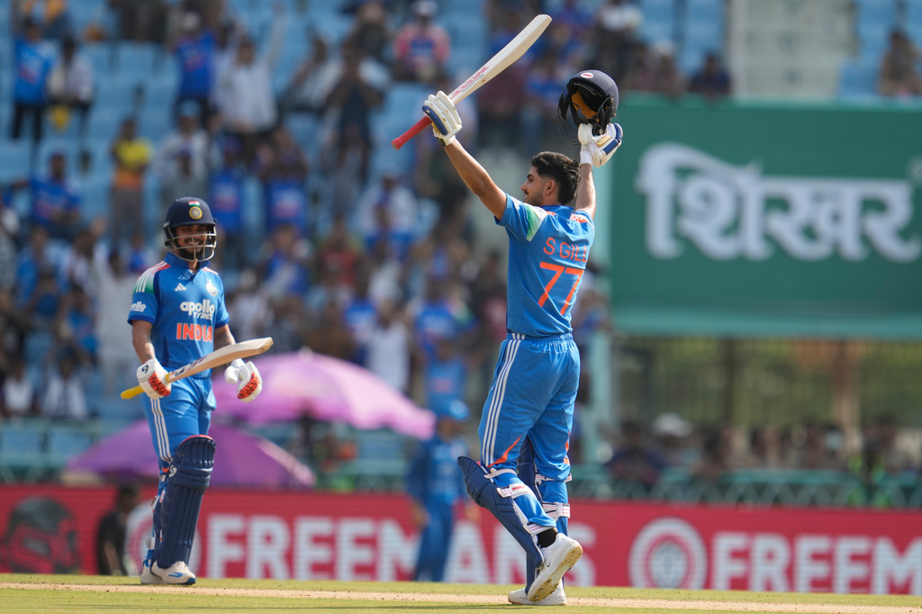 India's captain Shubman Gill, right, celebrates his century as India's Ishan Kishan looks on during the second ODI cricket match between India and Afghanistan in Lucknow, India, Wednesday, June 17, 2026. (AP Photo/Manish Swarup)