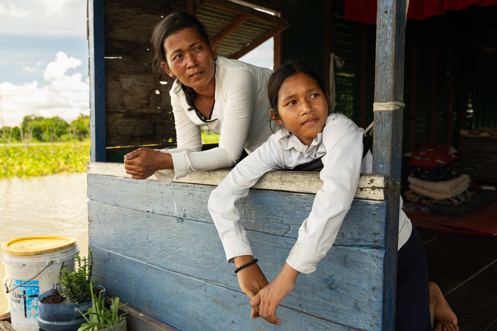 Nhim San, left, and her daughter, Sou Sreynich, at their home in a floating village on Cambodia's Tonle Sap Lake on Monday, June 29, 2026. (AP Photo/Anton L. Delgado)