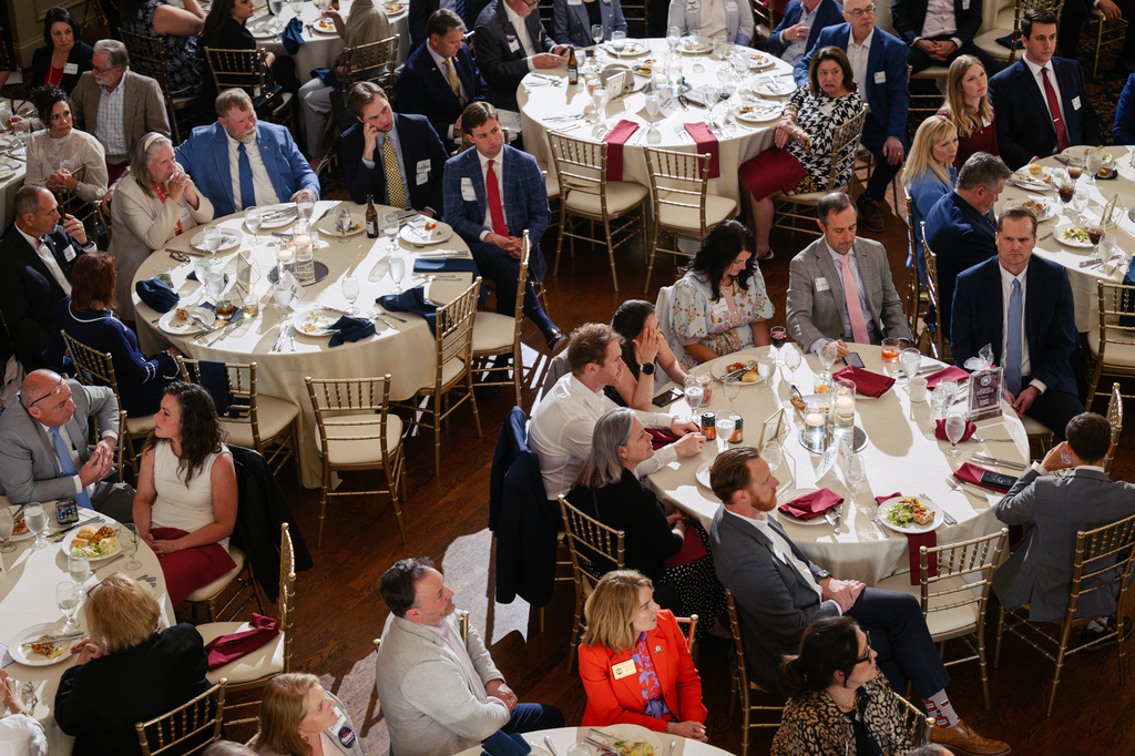 Guests look on as candidates speak on stage during the Kenton County Republican Party Lincoln Day Dinner, Thursday, April 30, 2026, in Covington, Ky. (AP Photo/Jon Cherry)