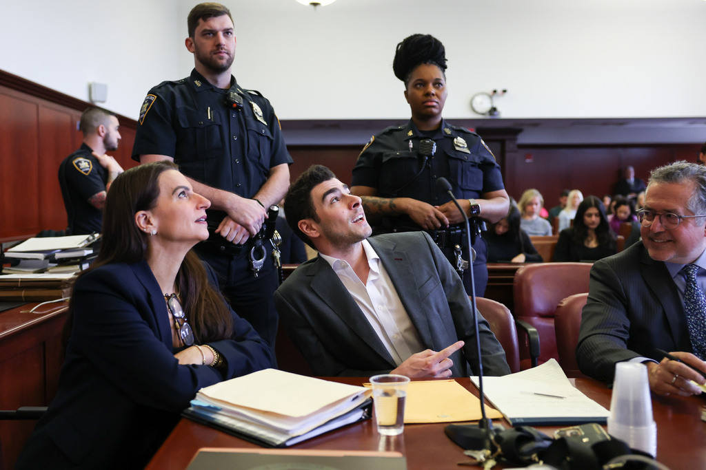 Luigi Mangione appears in court alongside his attorneys Karen Friedman Agnifilo, left, and Marc Agnifilo for an evidence hearing, Thursday, Dec. 4, 2025, in New York. (Angela Weiss/Pool Photo via AP)