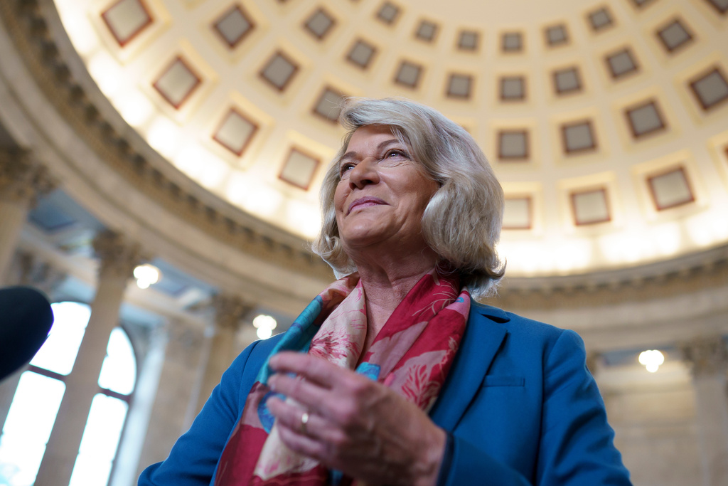 FILE - Sen. Cynthia Lummis, R-Wyo., arrives for an interview at the Capitol in Washington, Aug. 10, 2021. (AP Photo/J. Scott Applewhite, File)