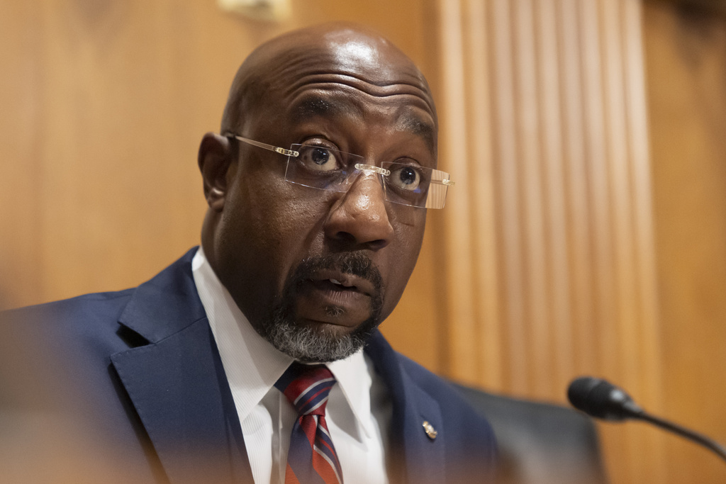 Sen. Raphael Warnock, D-Ga., speaks as Secretary of Health and Human Services Robert F. Kennedy Jr., appears before the Senate Finance Committee, on Capitol Hill in Washington, Thursday, Sept. 4, 2025. (AP Photo/Mark Schiefelbein)