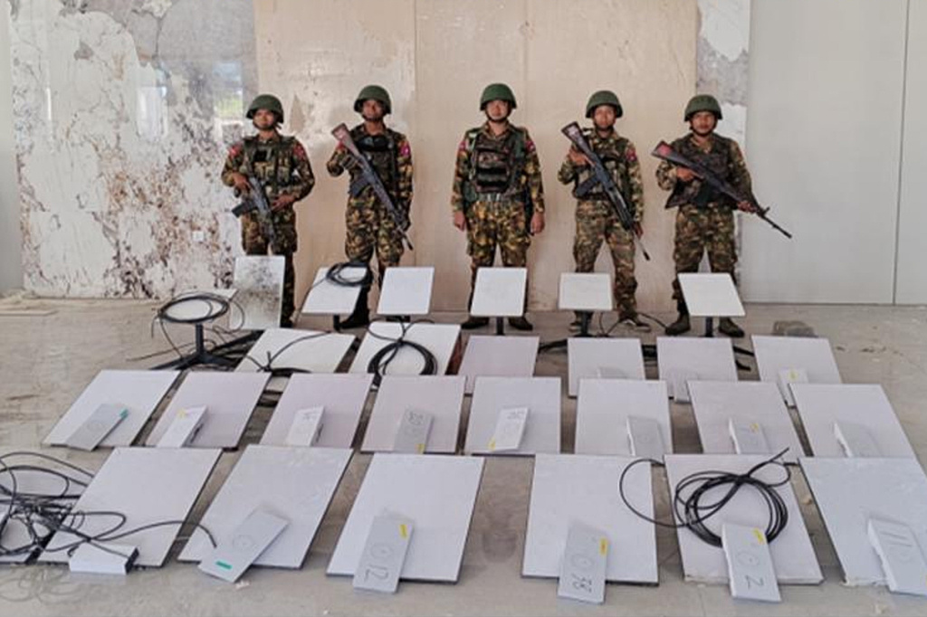 FILE - In this image provided by the Myanmar military on Oct. 19, 2025, soldiers stand next to Starlink satellite internet devices from the KK Park scam compound in Myawaddy township, Karen State, Myanmar. (The Myanmar Military True News Information Team via AP, File)