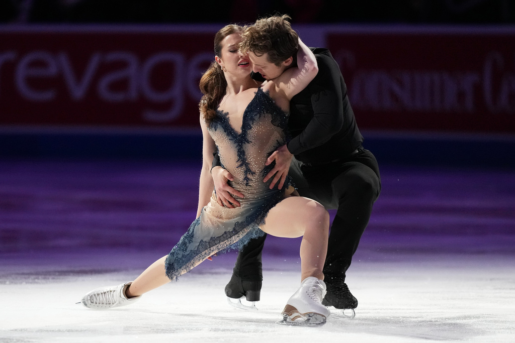 Christina Carreira and Anthony Ponomarenko skates during the "Making Team USA" performance at the U.S. Figure Skating Championships, Sunday, Jan. 11, 2026, in St. Louis. (AP Photo/Stephanie Scarbrough)